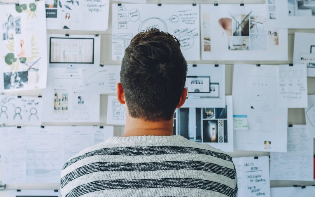 person looking at a work board for the article'10 Strategies to Rebuild Productivity After Narcissistic Abuse'