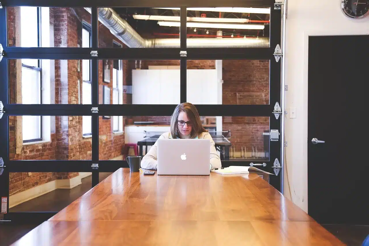 image of a woman in office for article on how to decenter men at work